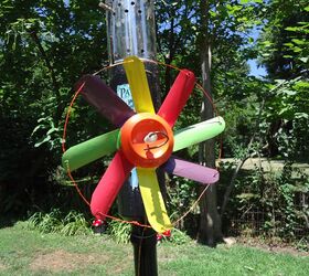 s 15 lovely repurposed items perfect for your garden, Snip A Soda Can Into A Wind Spinner
