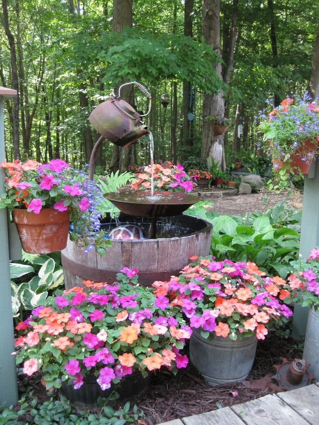 31 creative garden features perfect for summer, Upcycle a teapot into a rustic fountain