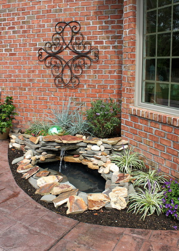31 creative garden features perfect for summer, Put a tiny waterfall pond beside your door