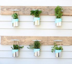 s save your old cans for these 30 home decor ideas, Use painted cans for a hanging planter