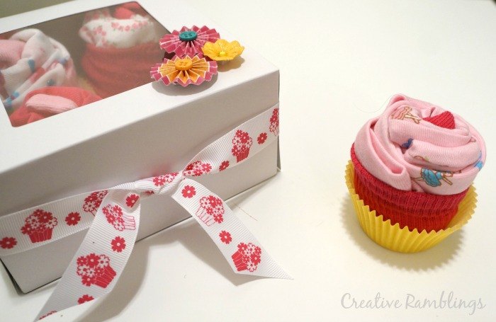31 clever ideas to reuse muffin pans and cupcake liners, Wrap This Adorable Baby Gift