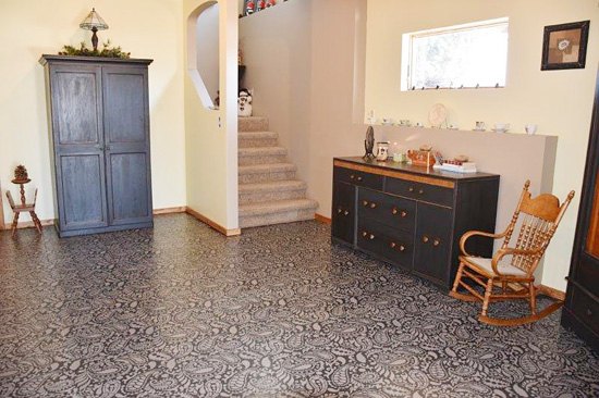 s 15 fabulous ways to pretty up your flooring for less, Brush A Paisley Print On Your Basement Floor