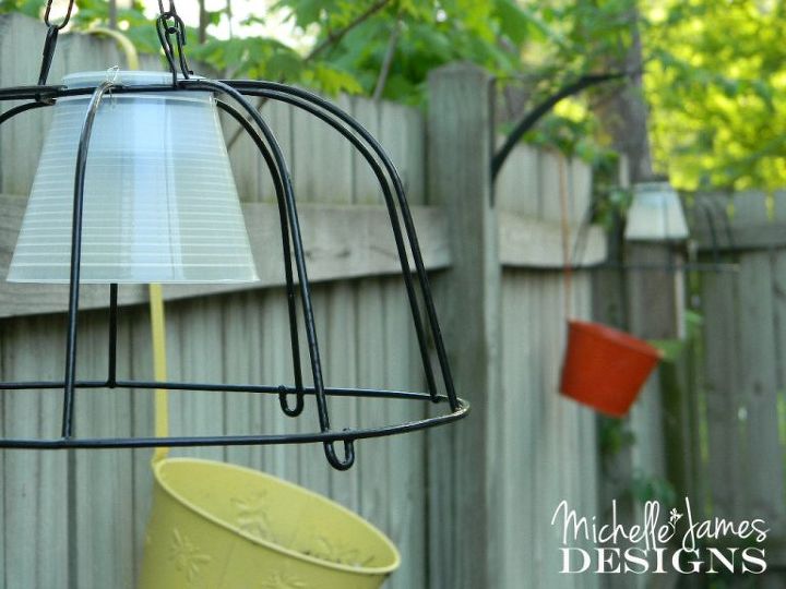 s 16 stunning ways for you to add solar lighting, Combine A Hanging Planter And Solar Lamps