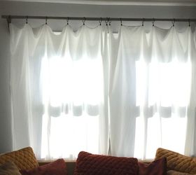 s 15 home decor projects to instantly transform your living room, Hang Sheet Curtains With A Rustic Look
