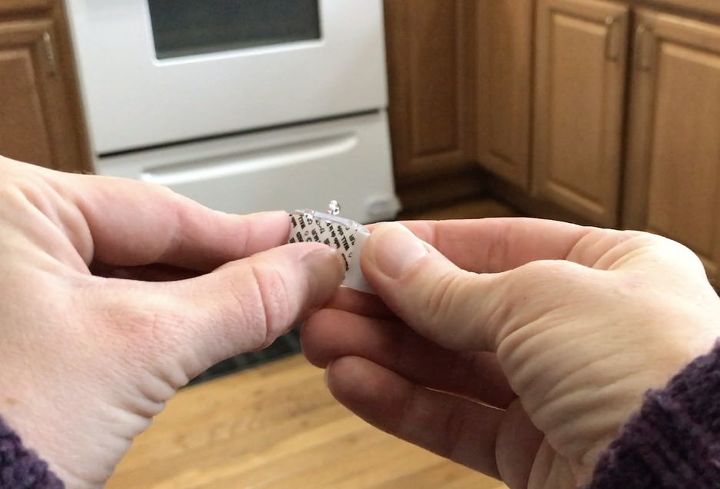 stick command hooks under your kitchen cabinets for genius lighting