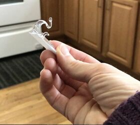 stick command hooks under your kitchen cabinets for genius lighting