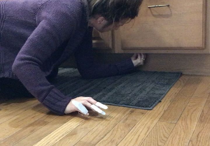 stick command hooks under your kitchen cabinets for genius lighting
