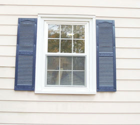 s 29 ways to get a splash of blue in your house, Spray Paint Your Shutters In Navy Blue