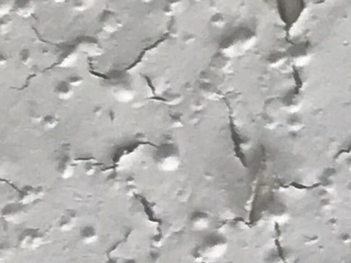 q what causes paint to peel or crack after being painted on a ceiling