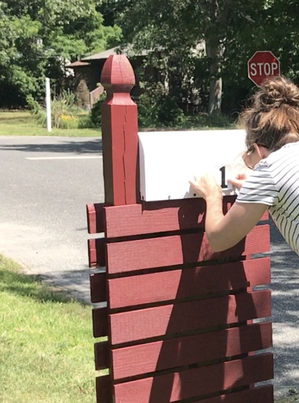 s 15 ways pretty places to put your mail organized, Wedge In A Mailbox Near Greenery