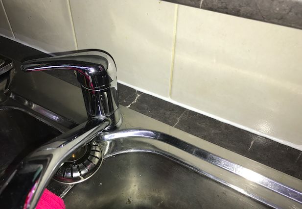silicone caulking to the back of a sink shower almost anywhere