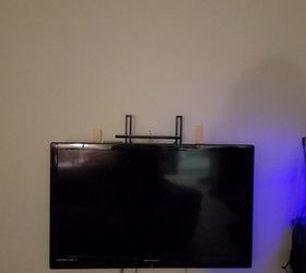 how can i creatively hide these ugly tv mounts