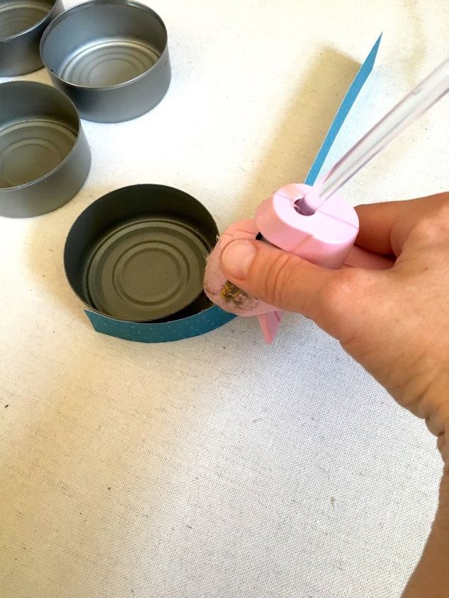 s transform tuna cans into gorgeous lighting in 9 simple steps, Step 4 Hot glue paper strips to cans