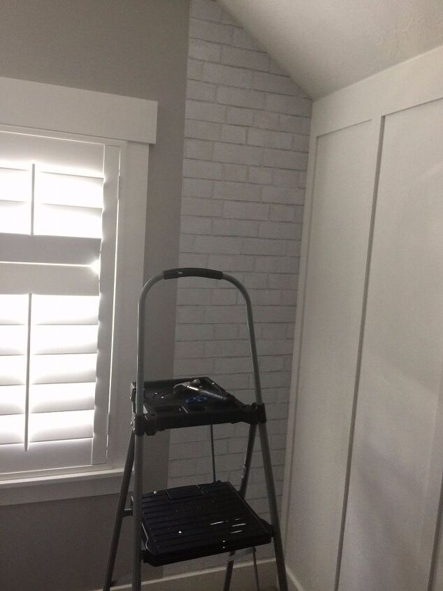 brick wallpaper and accent chalkboard wall
