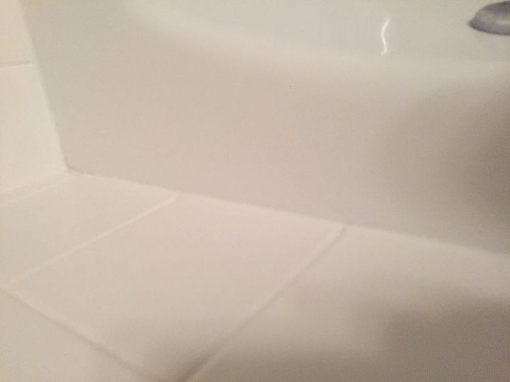 out with the old bathtub caulking and in with the new