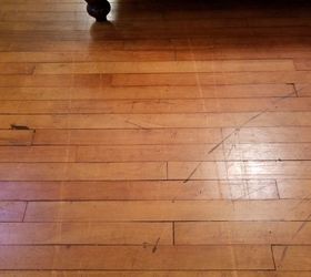 What is this stuff stuck on the hardwood floor? And how can I remove it?  Just removed the carpet : r/Flooring