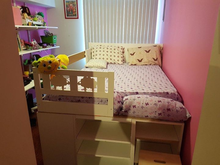 double bed with storage and a hiding nook