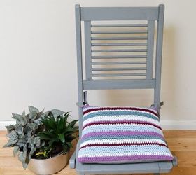 transform garden furniture with a bright striped crochet cushion