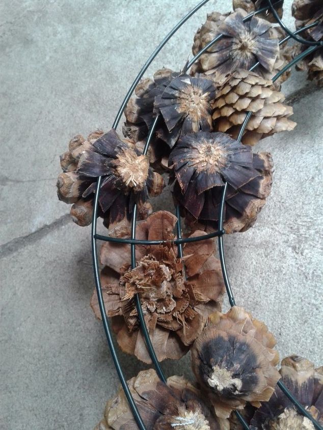 turn your dried out pine cones into a beautiful flower wreath