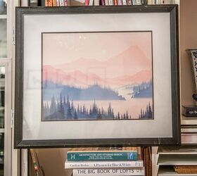 how to hang art on a bookshelf and still have easy access to the books