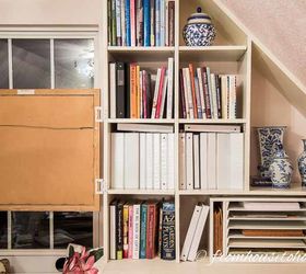 how to hang art on a bookshelf and still have easy access to the books