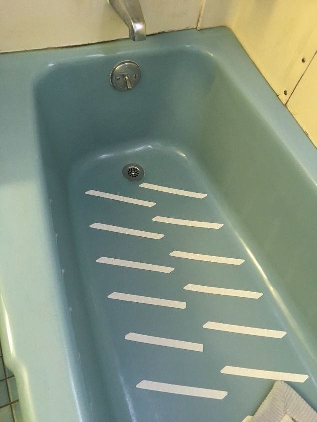 how do i remove a 50 year old porcelain cast iron tub from my bath