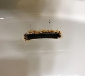 i have rust near the overflow hole on my bathroom sink how do i fix