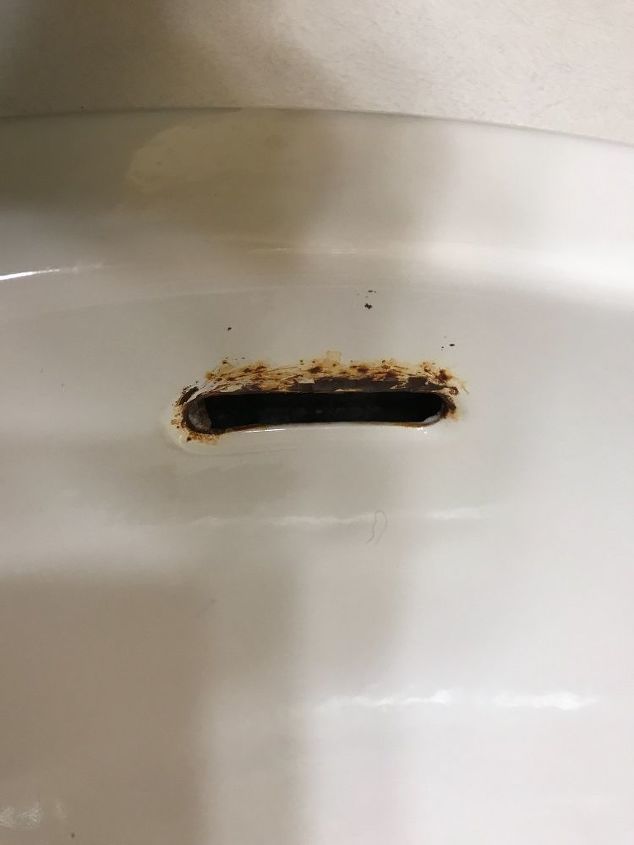 i have rust near the overflow hole on my bathroom sink how do i fix