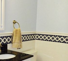 bathroom makeover with subway tile wainscoting before after