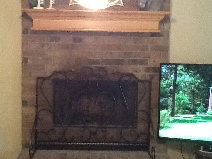 q what can i do to change this boring brick fireplace