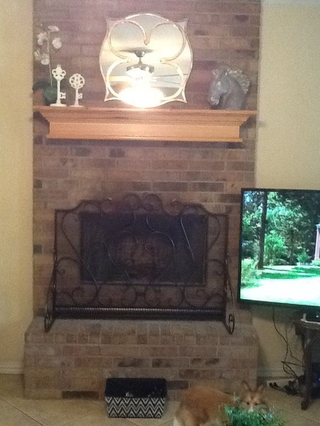 q what can i do to change this boring brick fireplace