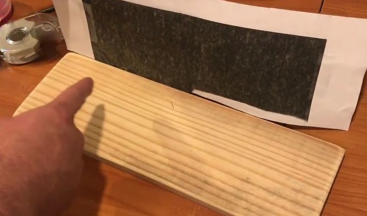 placa de madera de palet con letra de nio