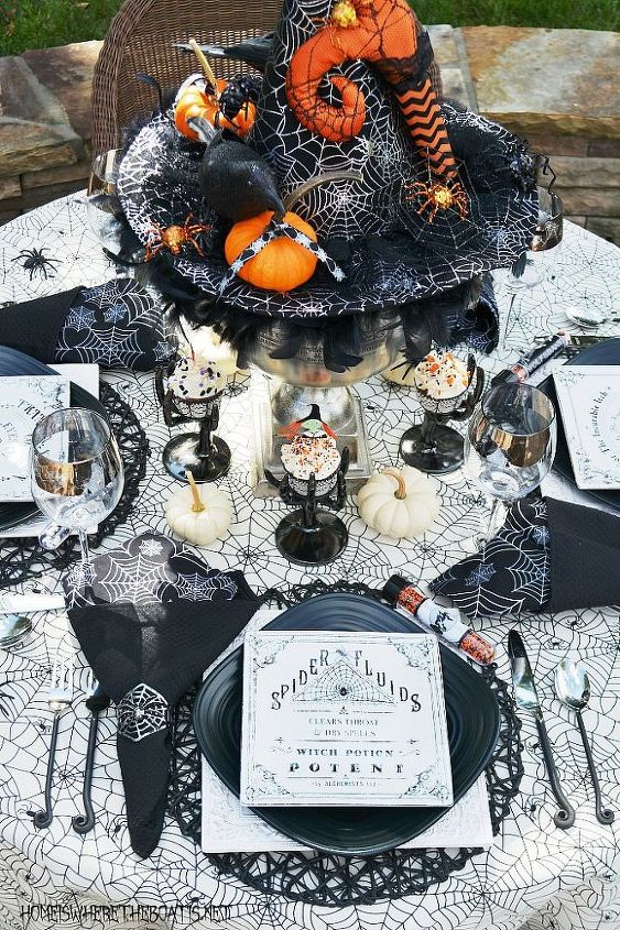 crea un centro de mesa de halloween hechizante con un sombrero de bruja