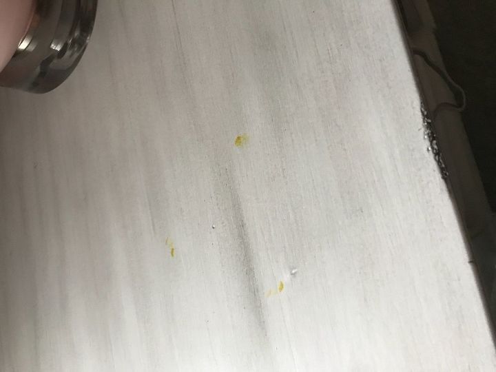 q yellow stain from rubber footpad on white furniture help
