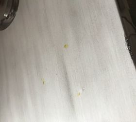 yellow stain from rubber footpad on white furniture help