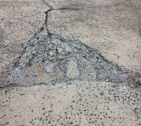 repairing broken concrete patch on driveway