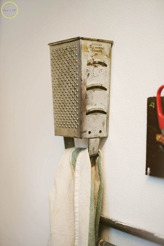 s 30 brilliant things you can make from cheap thrift store finds, Nail an Old Grater as a Kitchen Towel Hanger