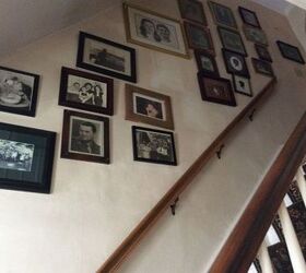 need to re hang pictures on a staircase wall nail holes enlarged