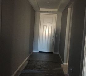 q entry to the house is a dark hallway