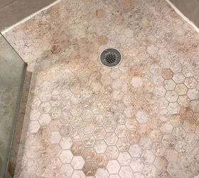 q how can i get rid of very old stain on my shower floor