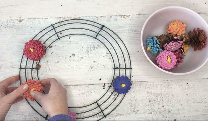 s 3 wreath ideas to brighten up your front door, Step 5 Grab wire wreath twist the pinecone