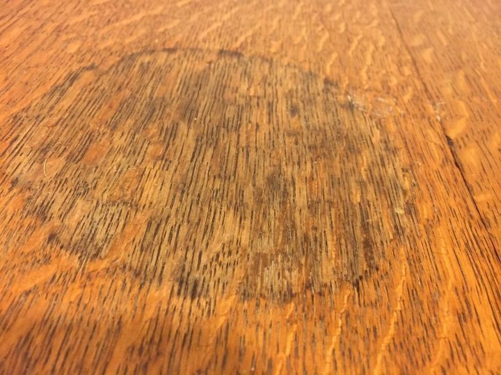 Does anyone know how to get a watermark off of an old wood table top