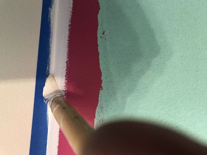 a simple trick to get a pro paint finish to a feature wall, Sealing the edge with the main wall colour
