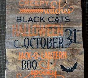 adding a spooky sign to the potting shed for halloween