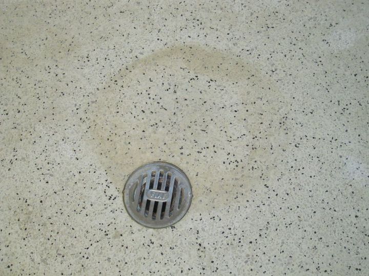 q how do i clean stains from a glazed concrete shower floor