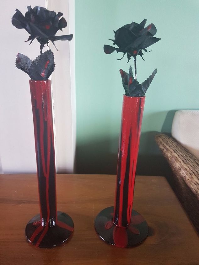vase painted to look like a black candle dripping red wax