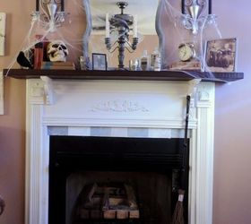 a spooky haunted library inspired halloween mantel