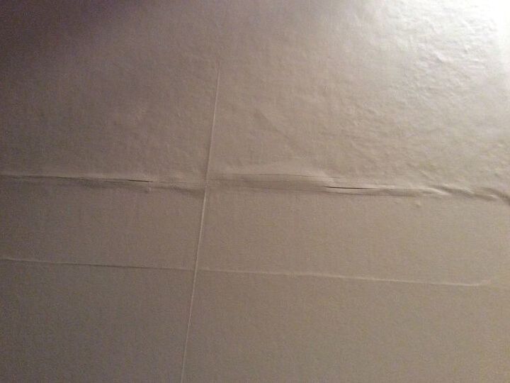 q mask a staircase wall finished with random pieces of paneling