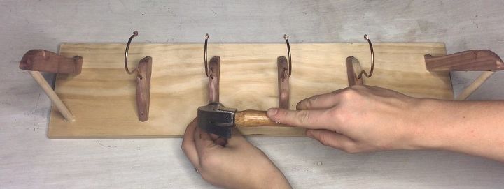 turn a cake pan into a shelf more clever repurposing ideas, Step 5 Secure hooks with tack nails