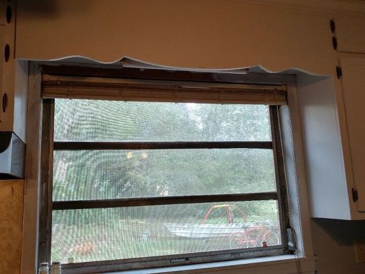q how can i jazz up my otherwise bland window that has a wooden cornice